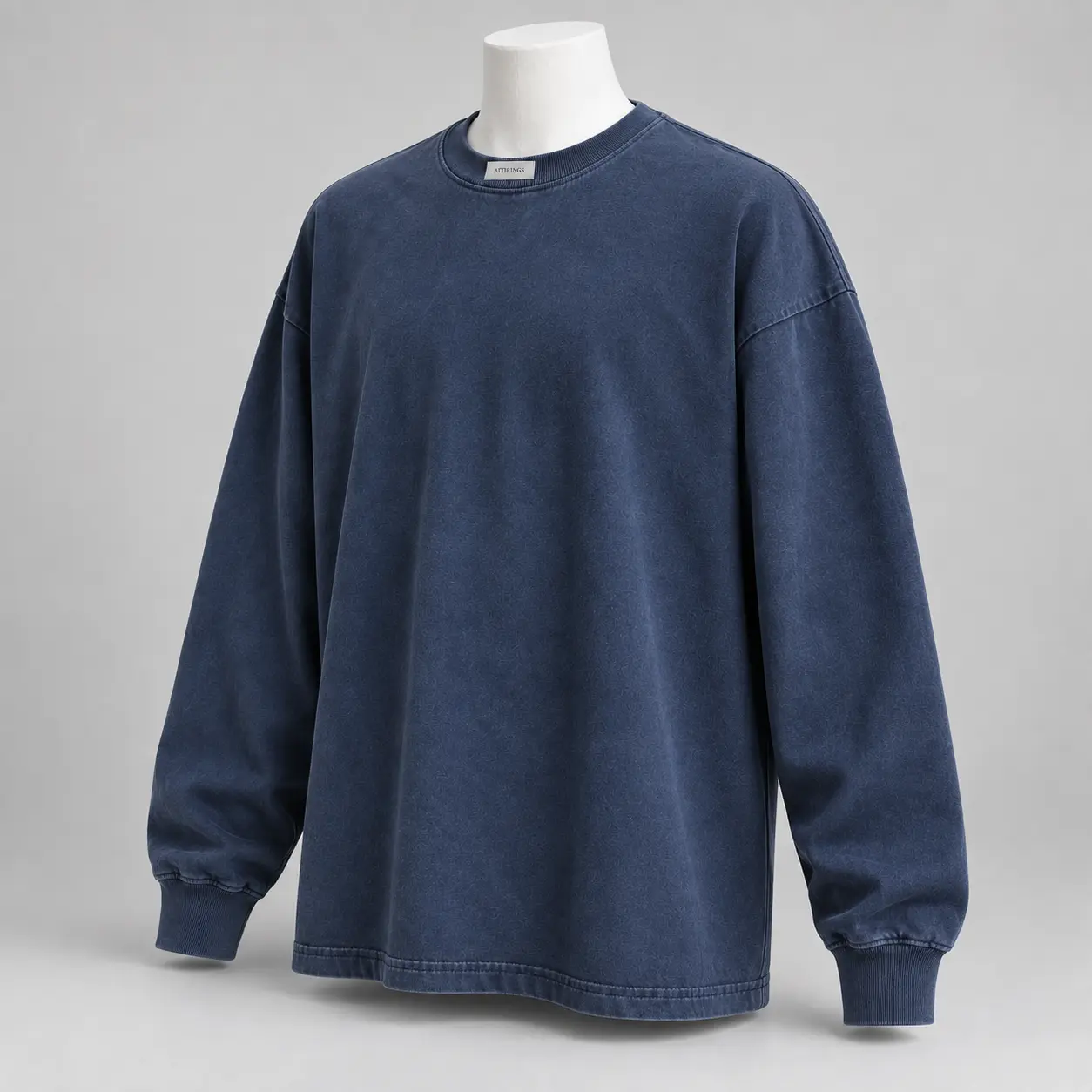 Men's Oversized Fit Long Sleeve T-Shirt in washed midnight indigo by Attirings, three-quarter view