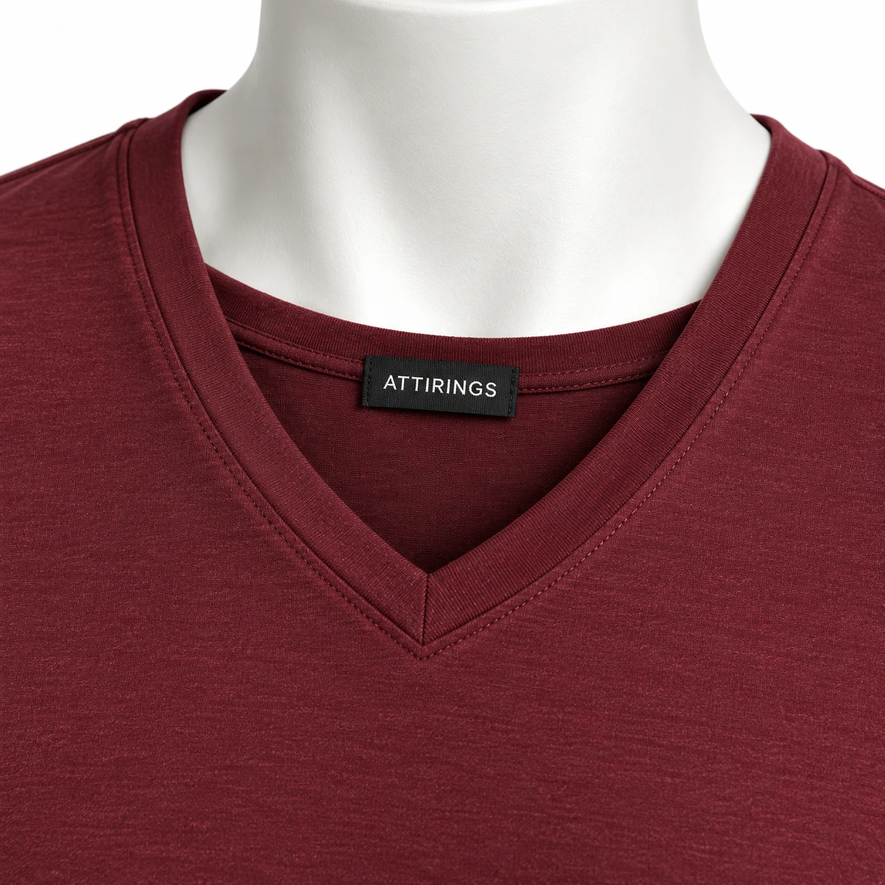 Men’s Slim Fit V-Neck T-Shirt – Detail View Close-up of burgundy T-shirt fabric and stitching